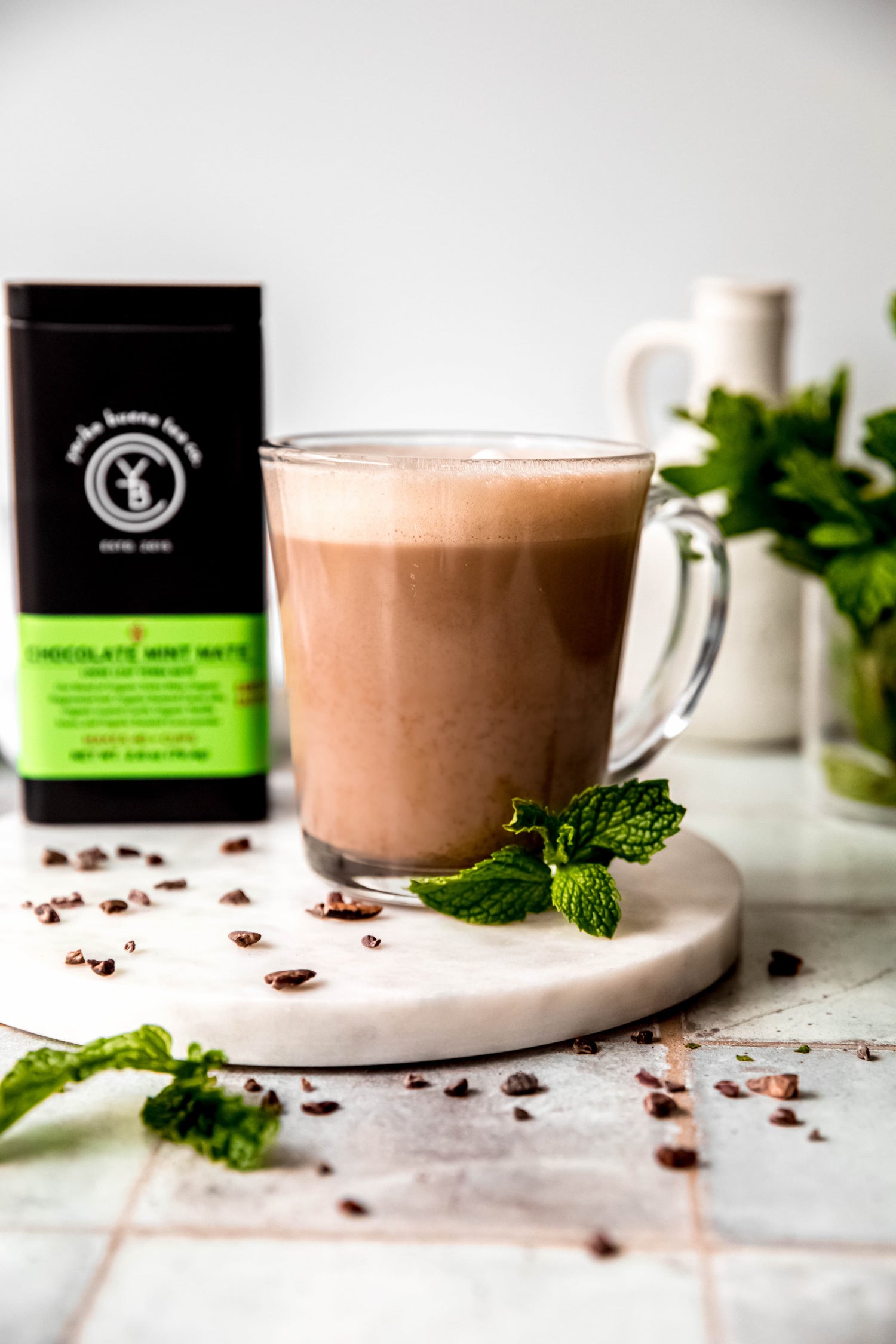 Chocolate mint yerba mate latte topped with foam in a ceramic mug, made with organic loose leaf mate by Yerba Buena Tea Co.