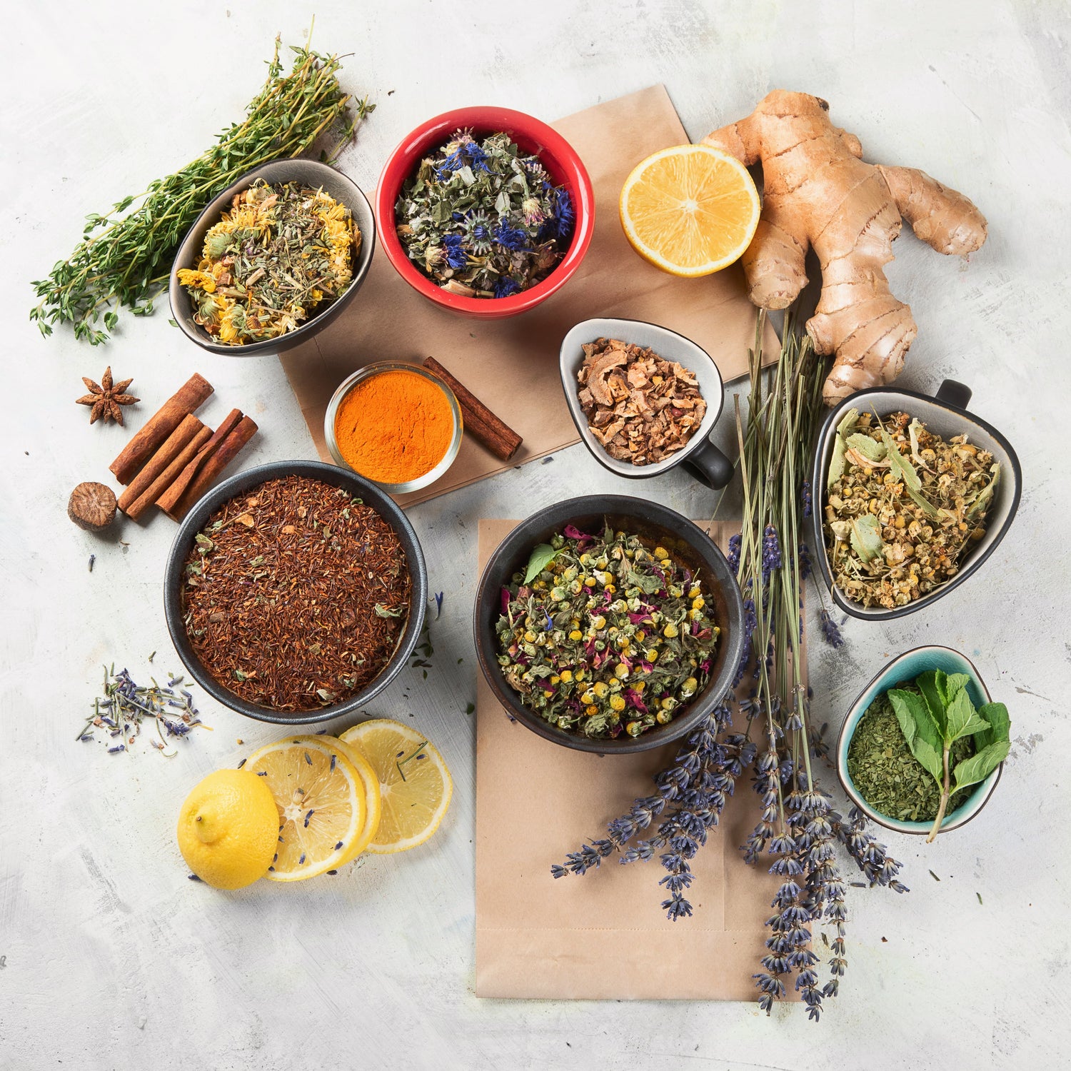 Whole organic tea ingredients beside processed flavored tea, showing the difference real botanicals make, by Yerba Buena Tea Co.