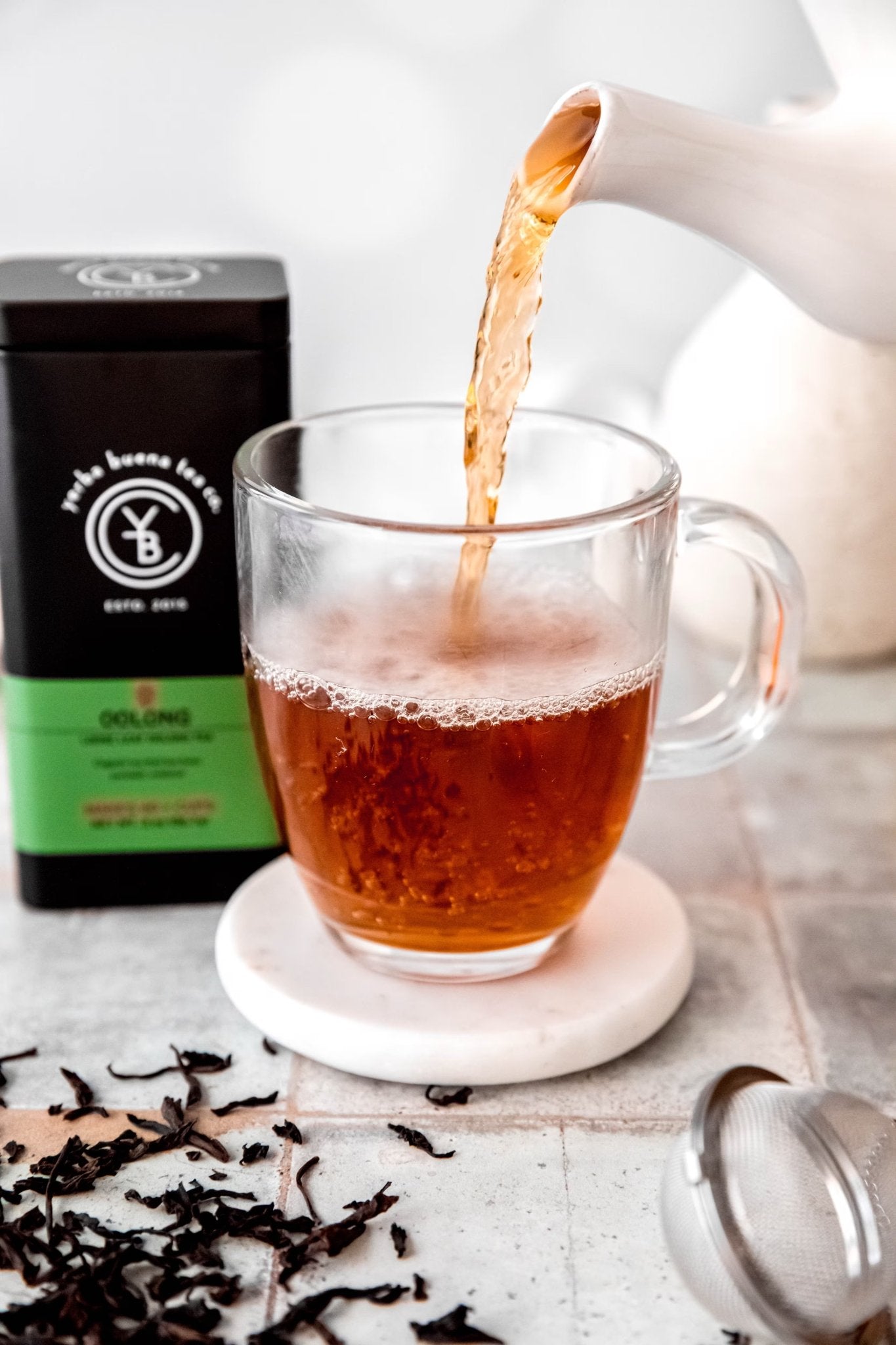 Single-origin loose leaf teas including Jasmine Pearls, Darjeeling, and Pu'erh from the YBTCO Connoisseur Collection