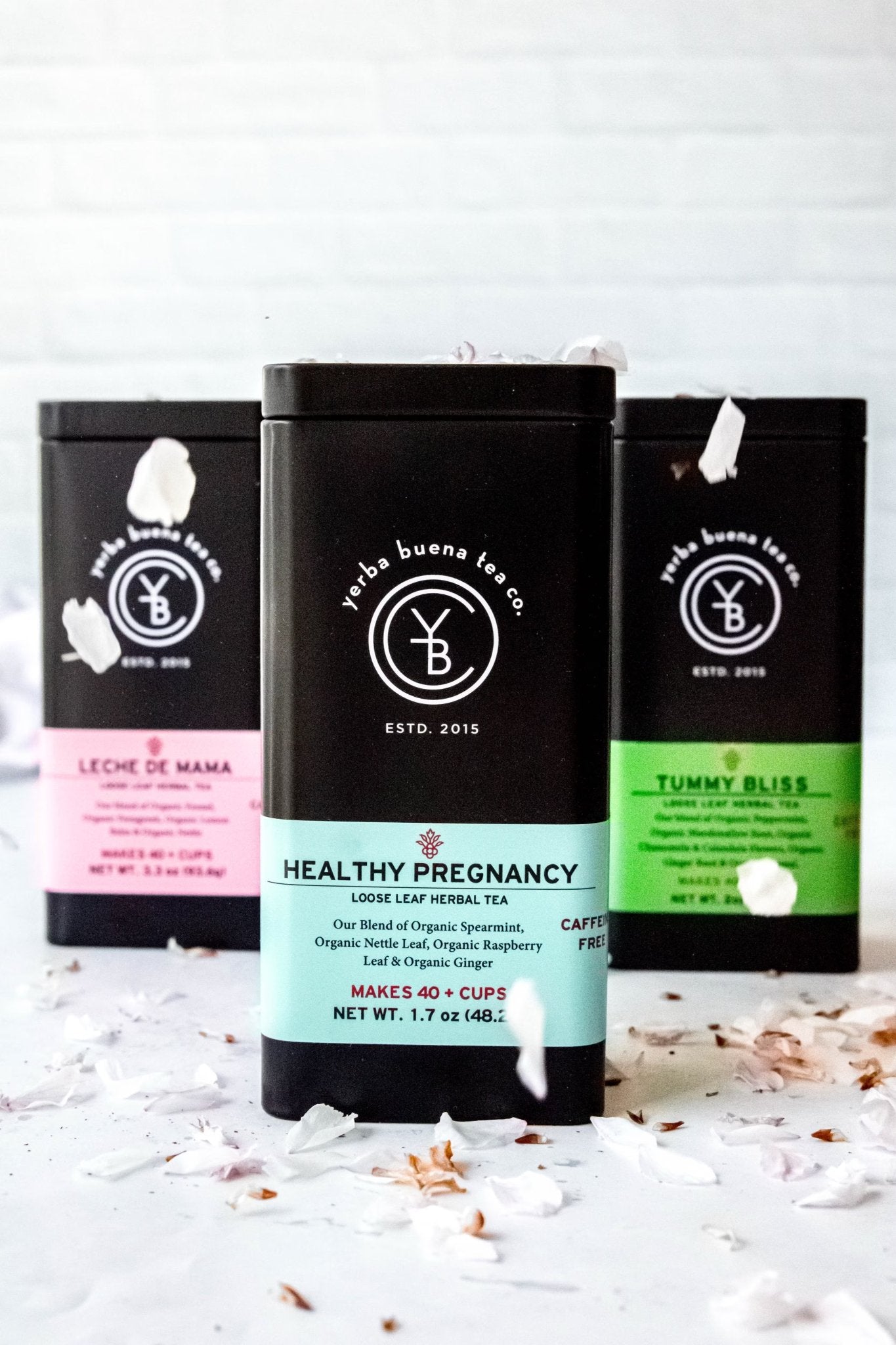 Red Raspberry Leaf tea steeping in a glass teapot, representing YBTCO's Women's Wellness collection for pregnancy and nursing support