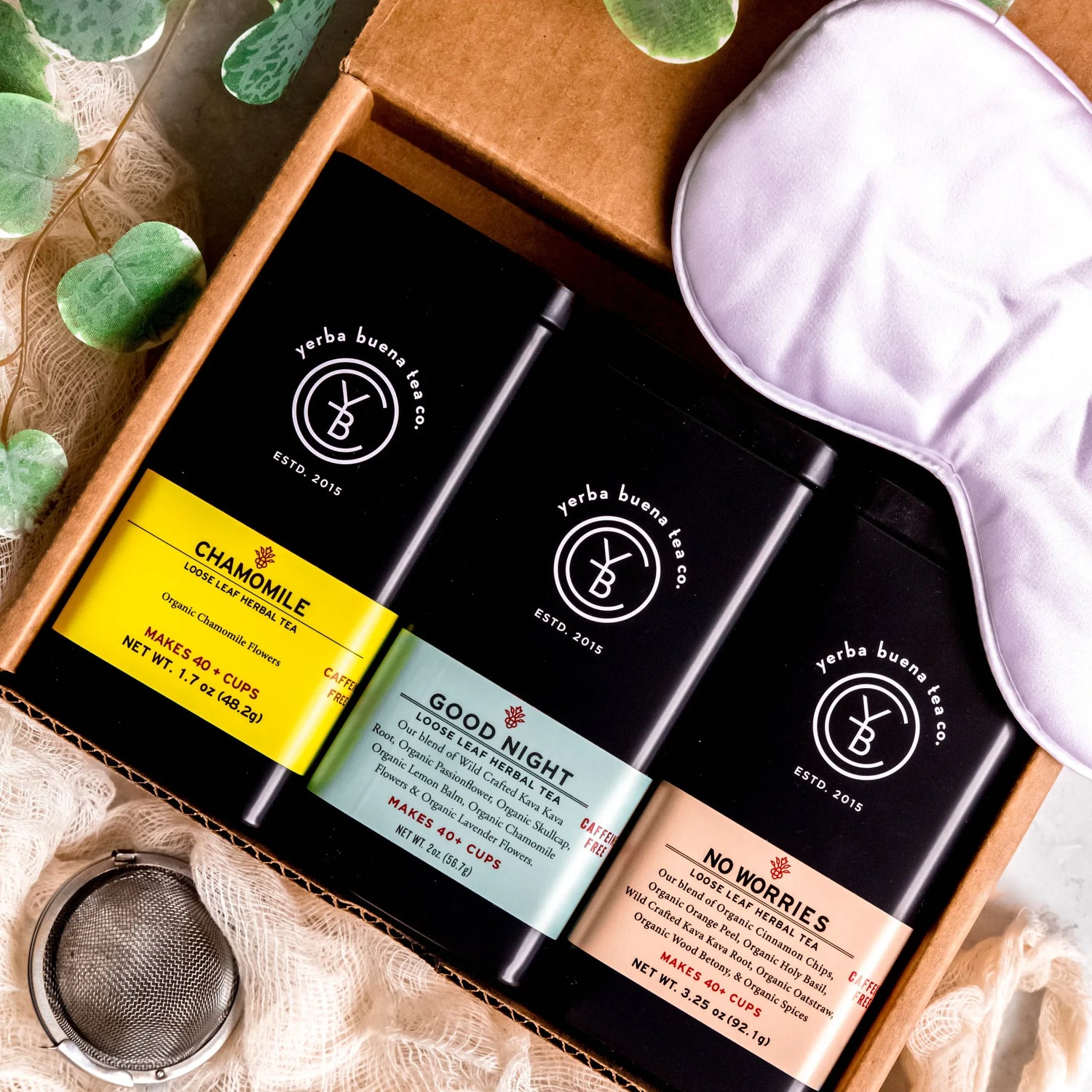 The Bedtime Box Set gift collection featuring Chamomile, Good Night, and No Worries loose leaf herbal teas in branded pouches arranged in a wooden box with styling accessories, by Yerba Buena Tea Company.