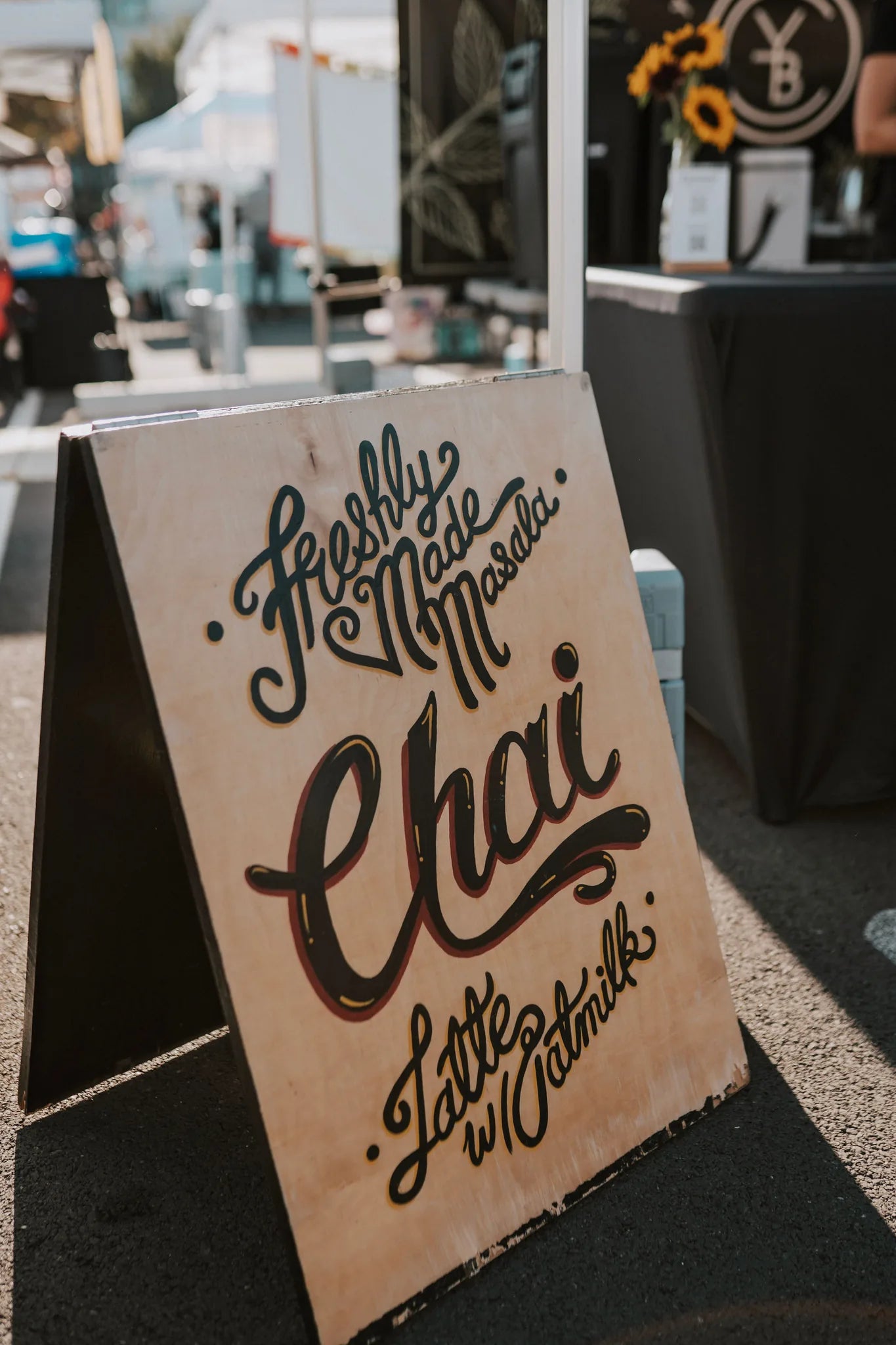Handwritten A-frame sign reading