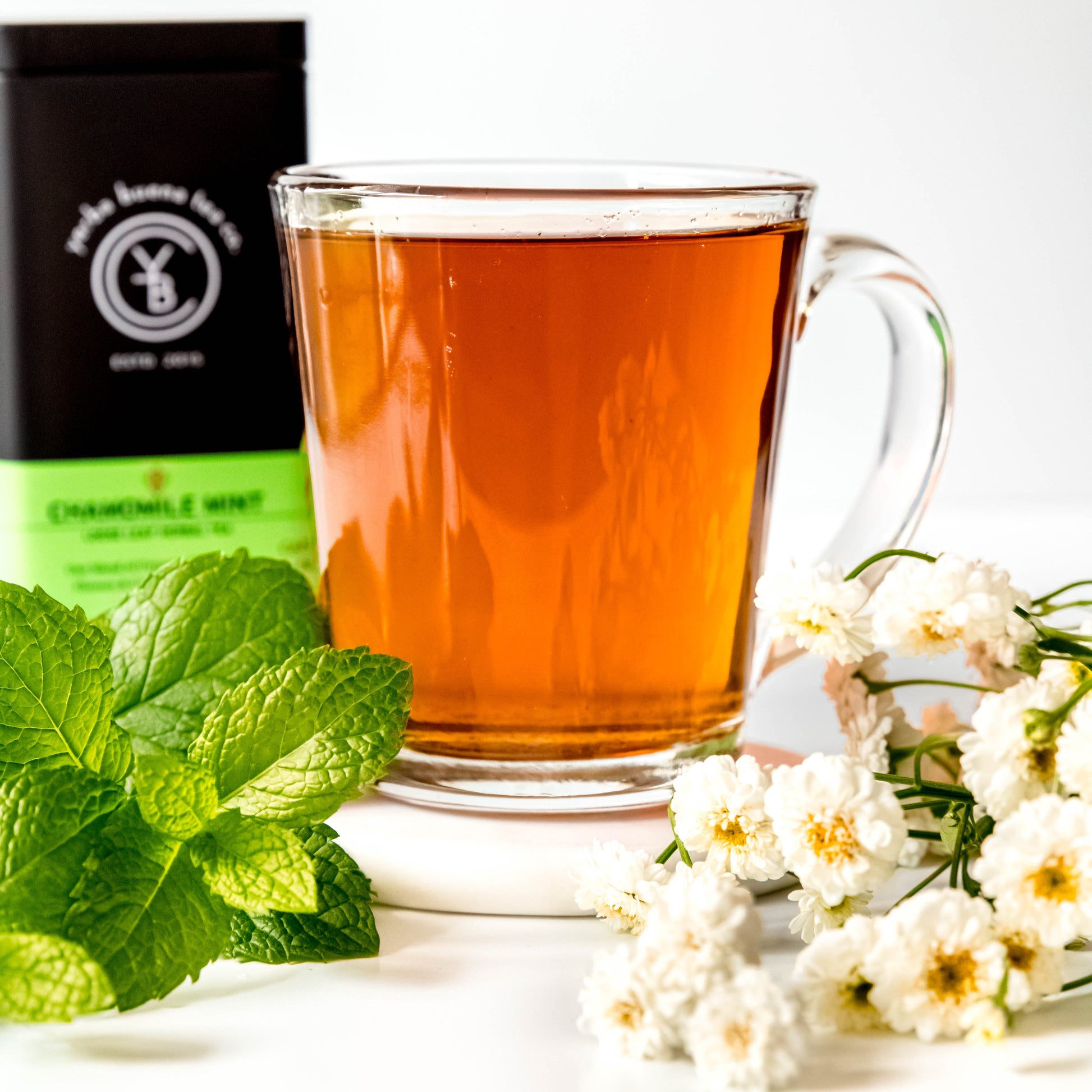 A cup of brewed Chamomile Mint tea from Yerba Buena Tea Co. Delicate floral and minty infusion with organic chamomile and peppermint.