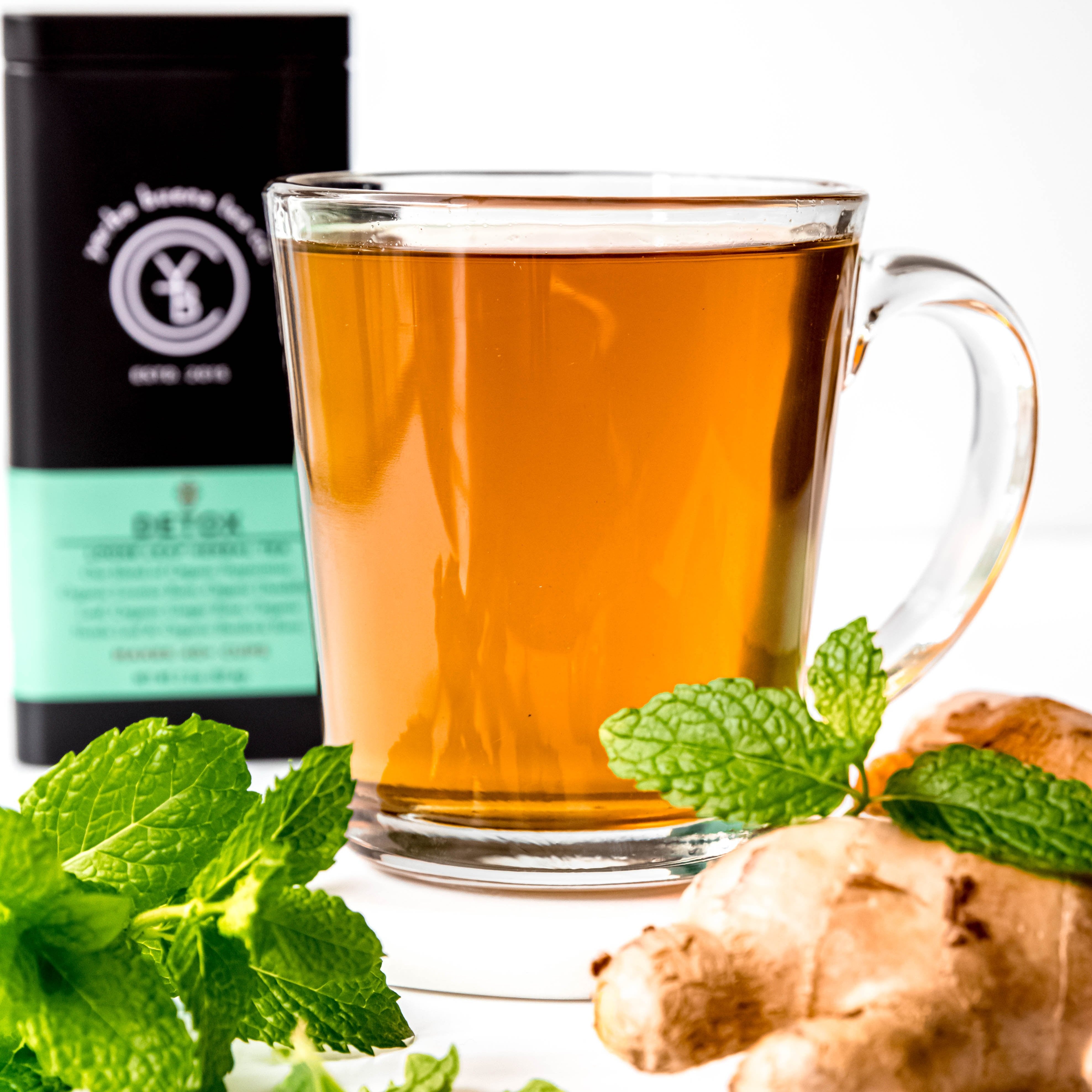 A cup of brewed Detox tea from Yerba Buena Tea Co. Refreshing infusion with minty and earthy notes.