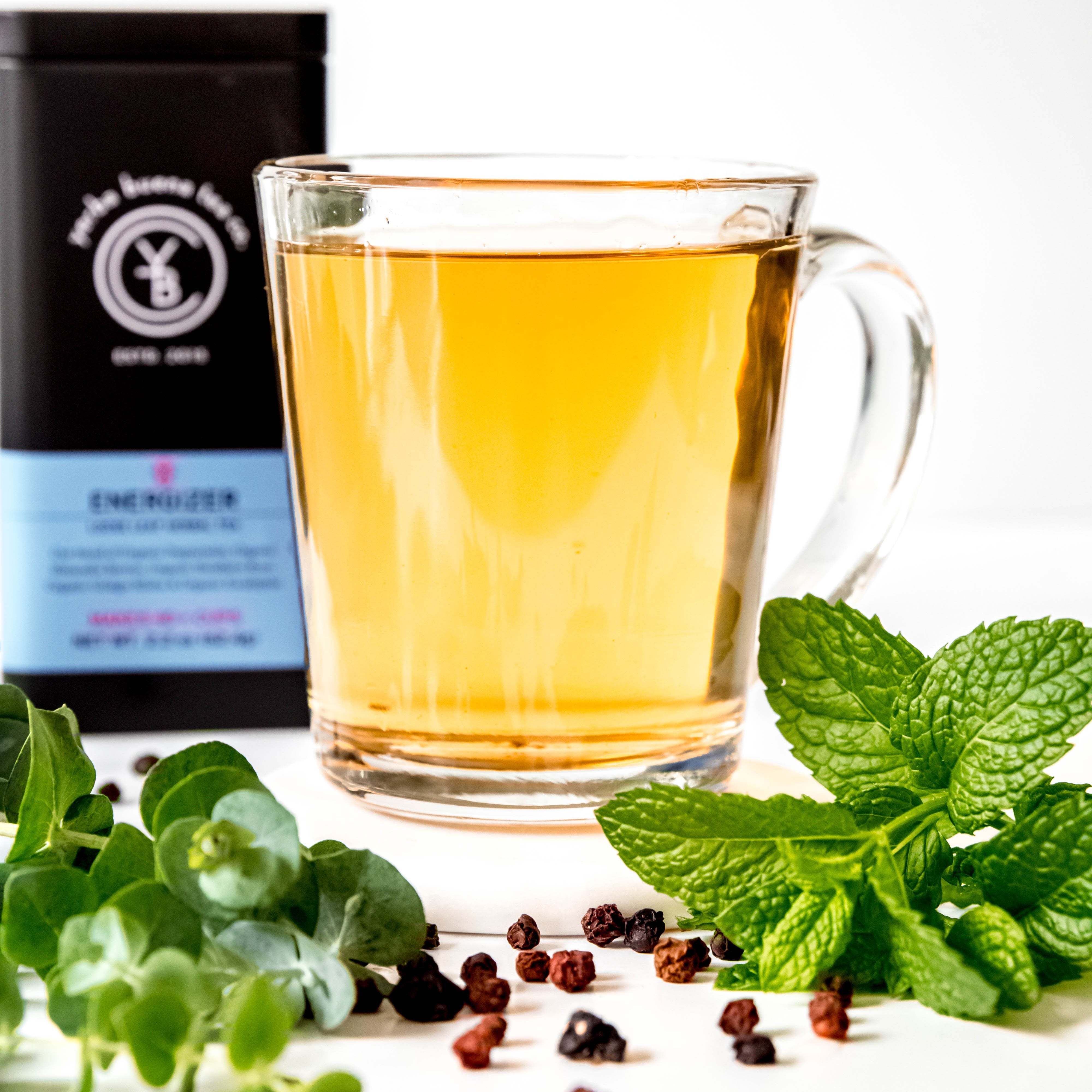 A cup of brewed Energizer tea from Yerba Buena Tea Co. Invigorating infusion with minty and herbal notes.