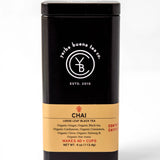 Chai loose leaf black tea in a black metal canister with gold label band, by Yerba Buena Tea Company.