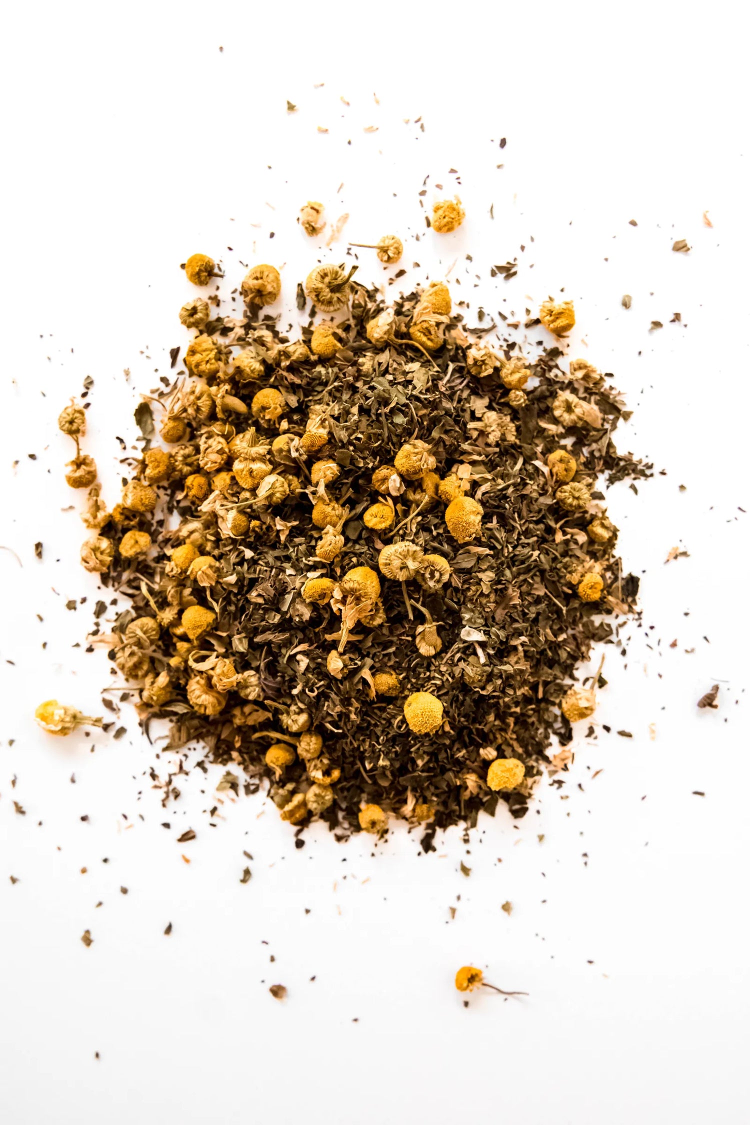 Loose leaf Chamomile Mint organic herbal tea displayed on a white background, featuring whole chamomile flowers blended with organic peppermint. A naturally caffeine-free herbal tea handcrafted in Oregon.