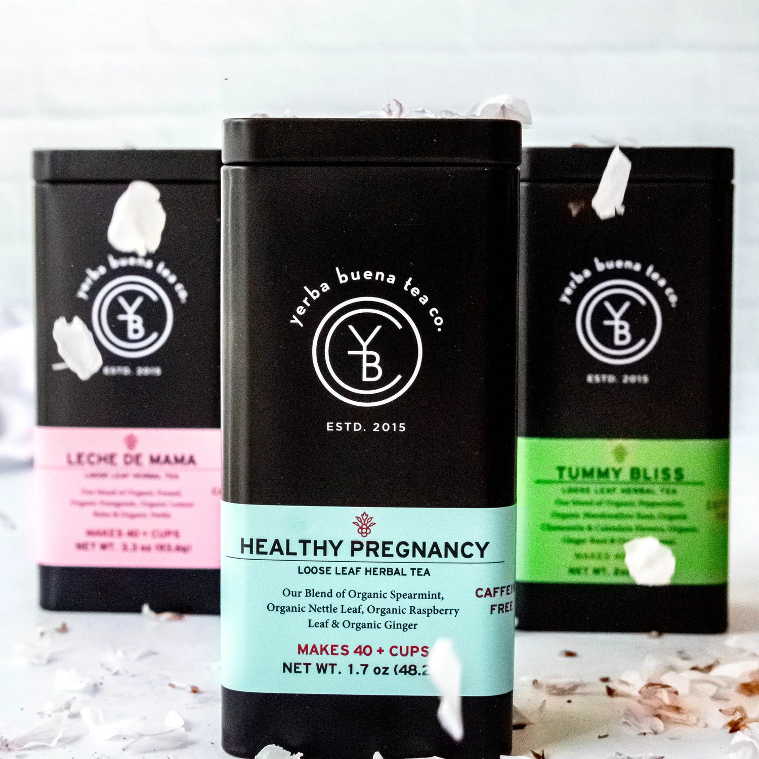 The Expecting Mothers Box Set gift collection featuring three loose leaf herbal teas: Leche de Mama, Healthy Pregnancy, and Tummy Bliss in branded pouches, by Yerba Buena Tea Company.