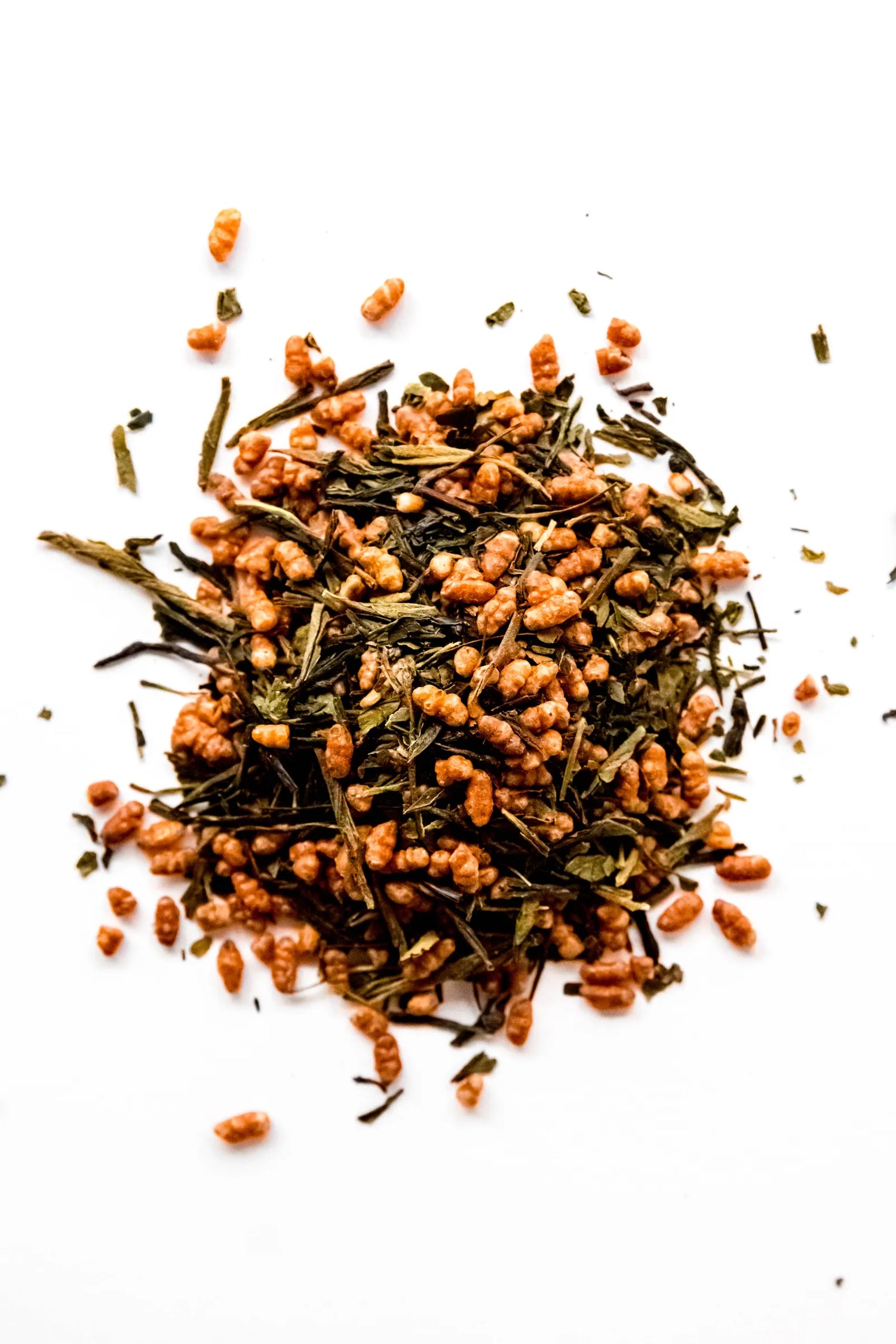 Loose leaf Genmaicha organic green tea displayed on a white background, featuring sencha green tea leaves mixed with toasted brown rice. A traditional Japanese-style green tea blend handcrafted in Oregon.