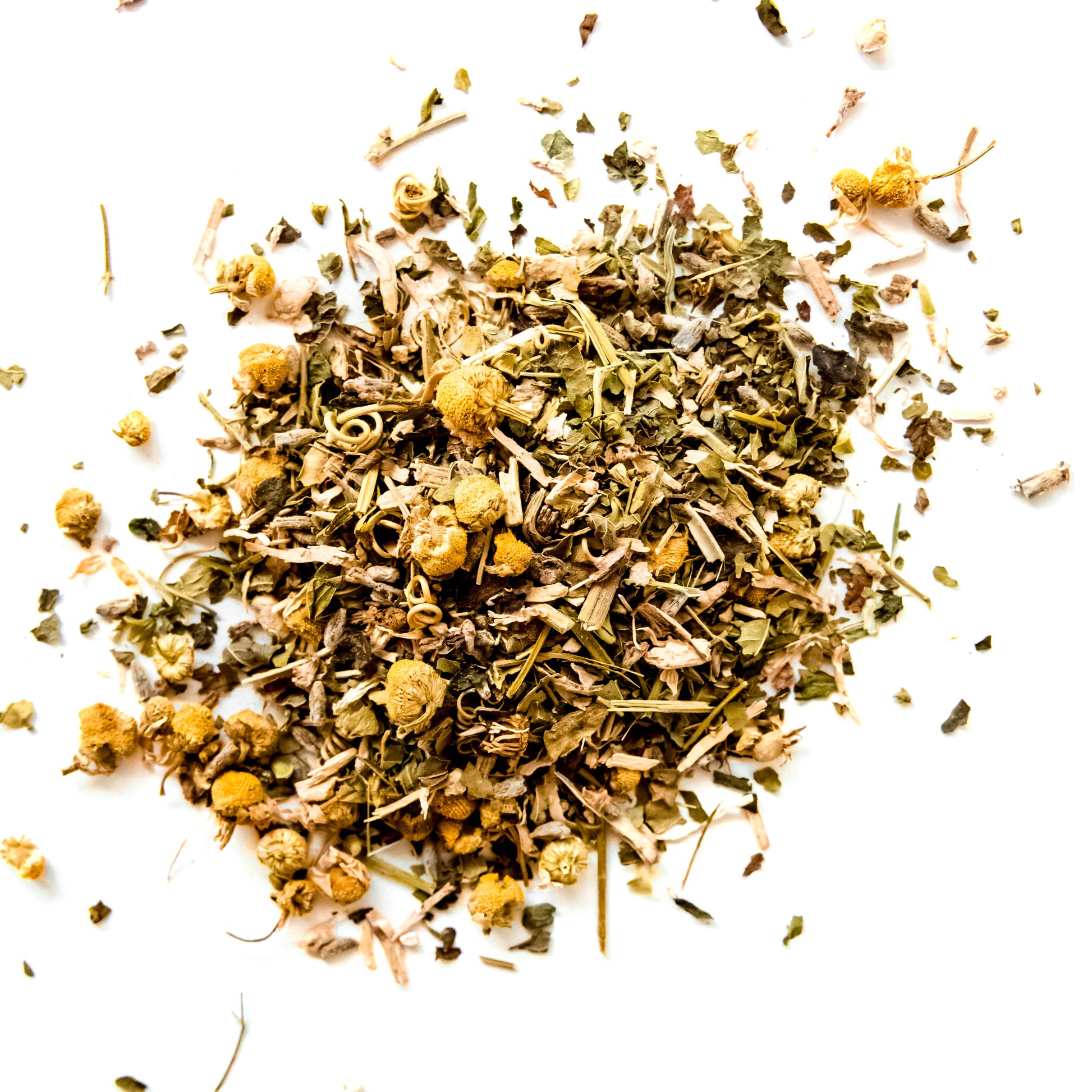 A close-up of loose-leaf Good Night tea blend, featuring a mix of calming herbs including kava kava root, passionflower, skullcap, lemon balm, chamomile flowers, and lavender flowers. The blend is displayed against a clean white background, highlighting the natural colors and textures of the ingredients.