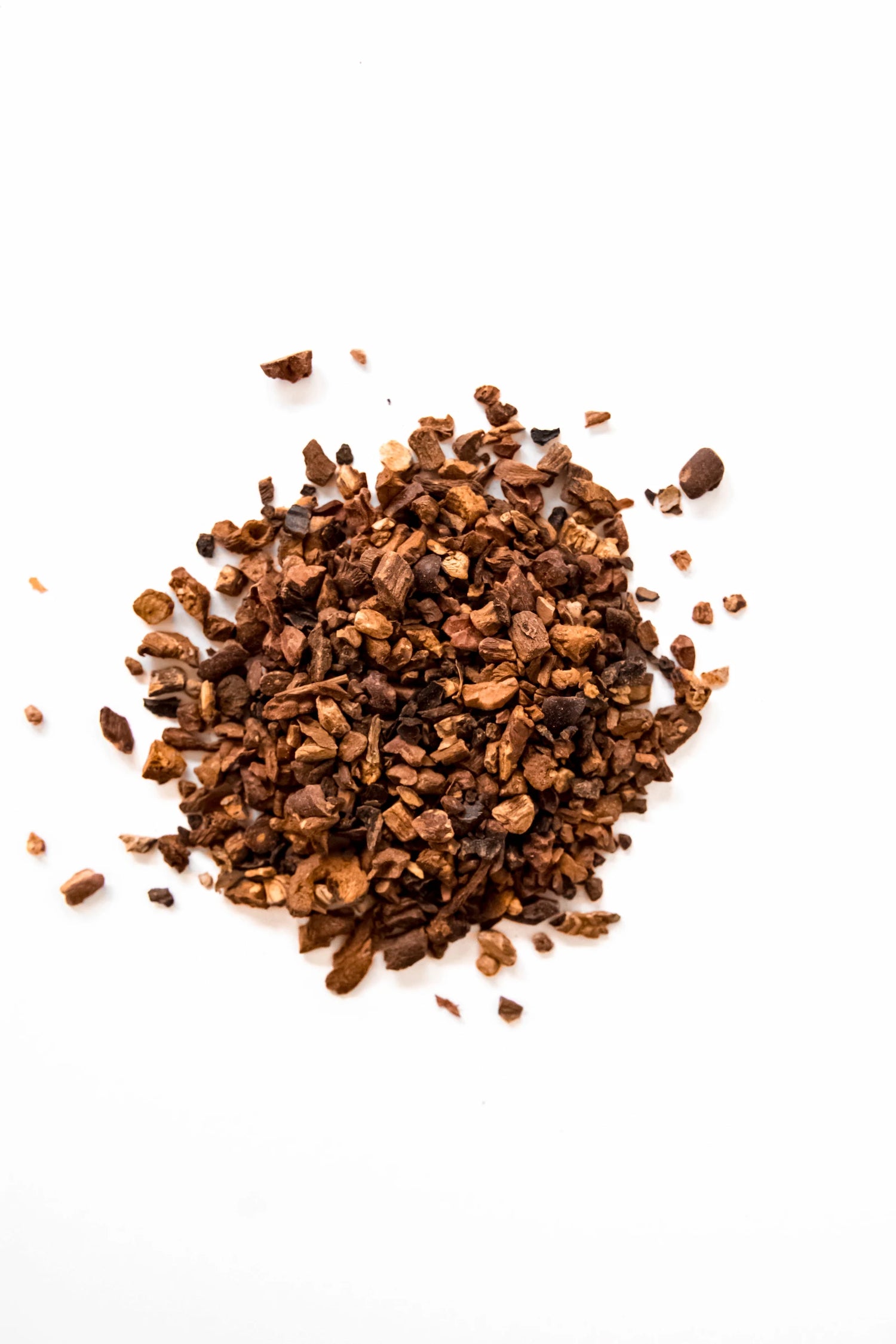 Loose leaf Herbal Coffee blend displayed on a white background, showing organic roasted chicory, dandelion root, cacao nibs, and carob pieces. A caffeine-free, coffee-style herbal blend handcrafted in Oregon.