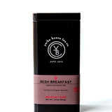Irish Breakfast loose leaf black tea in a black canister with mauve label band, by Yerba Buena Tea Company.