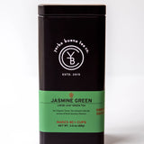Jasmine Green loose leaf green tea in a black and green cylindrical canister with white branding, by Yerba Buena Tea Company.