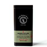 Mango Ceylon loose leaf black tea in a black canister with sage green label band, by Yerba Buena Tea Company.