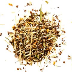 Loose leaf herbal tea blend with dried grasses, flowers, and botanical pieces scattered on white background, by Yerba Buena Tea Company.
