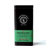 Northwest Mint loose leaf herbal tea in black canister with green label band, by Yerba Buena Tea Company.