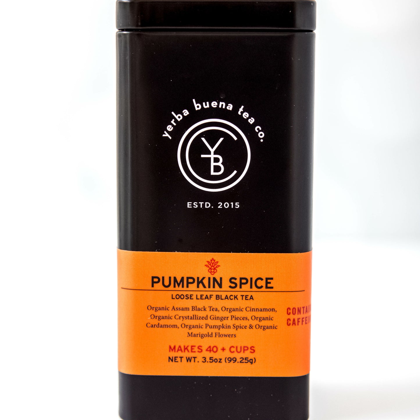 A black tin of Yerba Buena Tea Co.'s Pumpkin Spice loose leaf black tea, labeled as containing caffeine and made with organic Assam black tea, cinnamon, ginger, cardamom, pumpkin spice, and marigold flowers, on a white background.