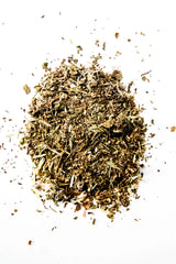 Loose leaf Refresh organic herbal tea on a white background, featuring spearmint, nettle leaf, red clover, red raspberry leaf, and oatstraw. A caffeine-free herbal blend handcrafted in Oregon.