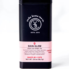 Skin Glow loose leaf herbal tea in a black canister with pink label band, by Yerba Buena Tea Company.