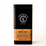 Smoky Chai loose leaf black tea in a black canister with gold label band, by Yerba Buena Tea Company.