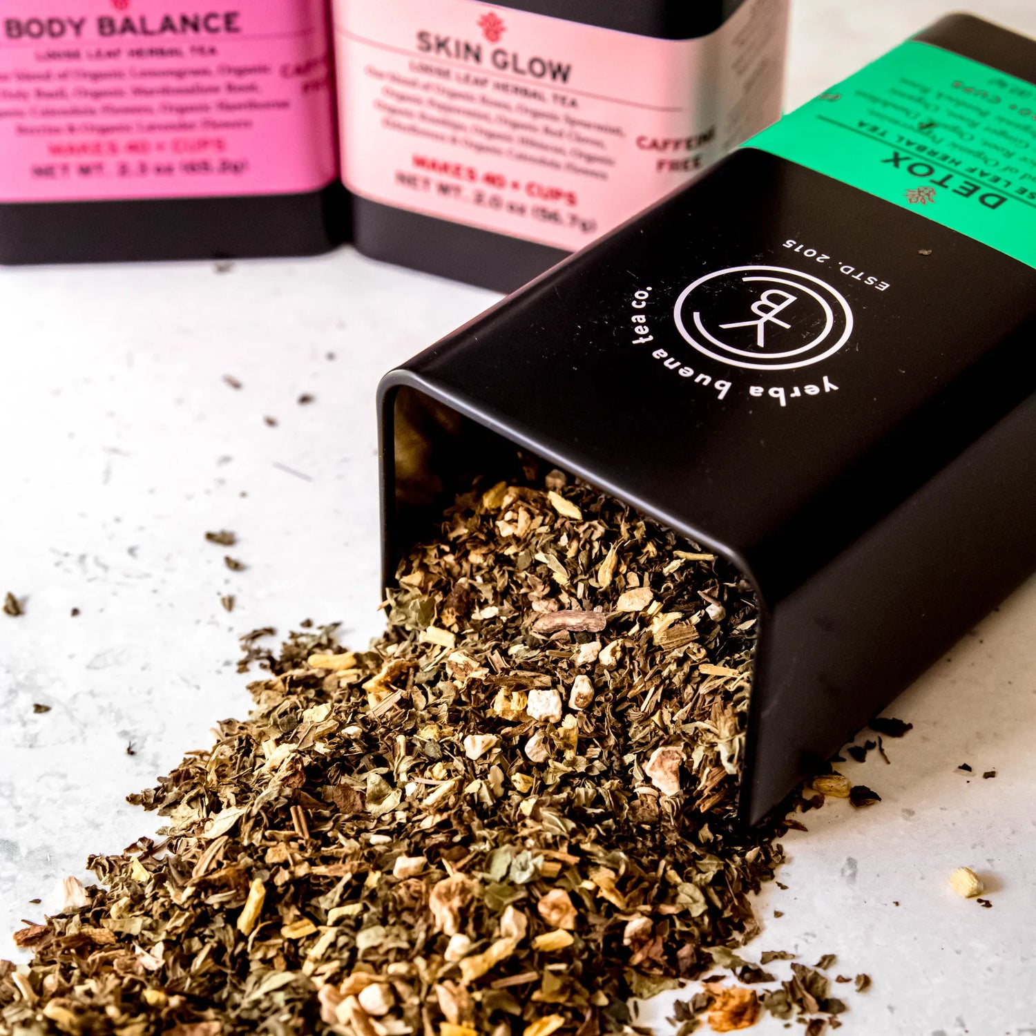 Wellness Self Care Box gift set with loose leaf herbal tea pouches including Body Balance and Skin Glow displayed on a white surface, by Yerba Buena Tea Company.
