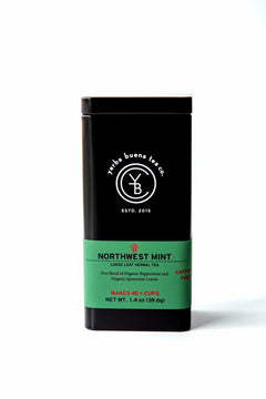 Front view of the signature black Yerba Buena Tea Co. tea tin for Northwest Mint organic herbal tea, featuring a bright green label highlighting the peppermint and spearmint blend.