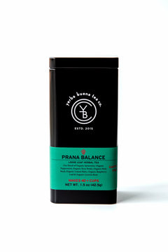 Front view of the signature black Yerba Buena Tea Co. tea tin for Prana Balance organic herbal tea, featuring a teal label with ingredient details.